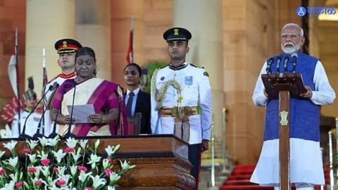 The swearing-in ceremony in the forecourt of Rashtrapati Bhavan, with the President of India at a podium and ceremonial guards in attendance.
