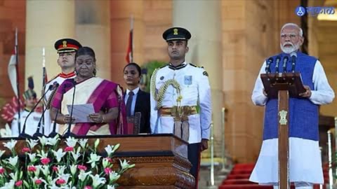 The swearing-in ceremony of the Union Council of Ministers in the forecourt of Rashtrapati Bhavan, with the President of India administering the oath at a podium.